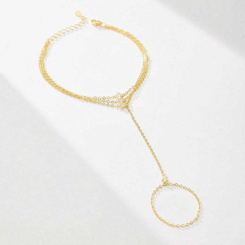 Brățară tip hand chain din argint placată cu aur cu design elegant